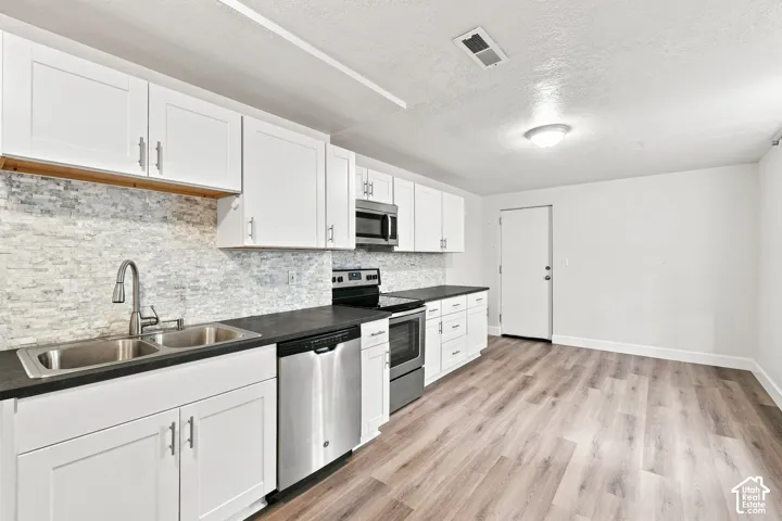 White cabinets and lovely tile backsplash