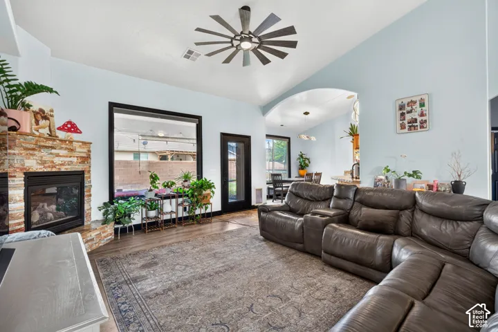 Spacious living room anchored by a leather sectional sofa and hardwood-finish flooring