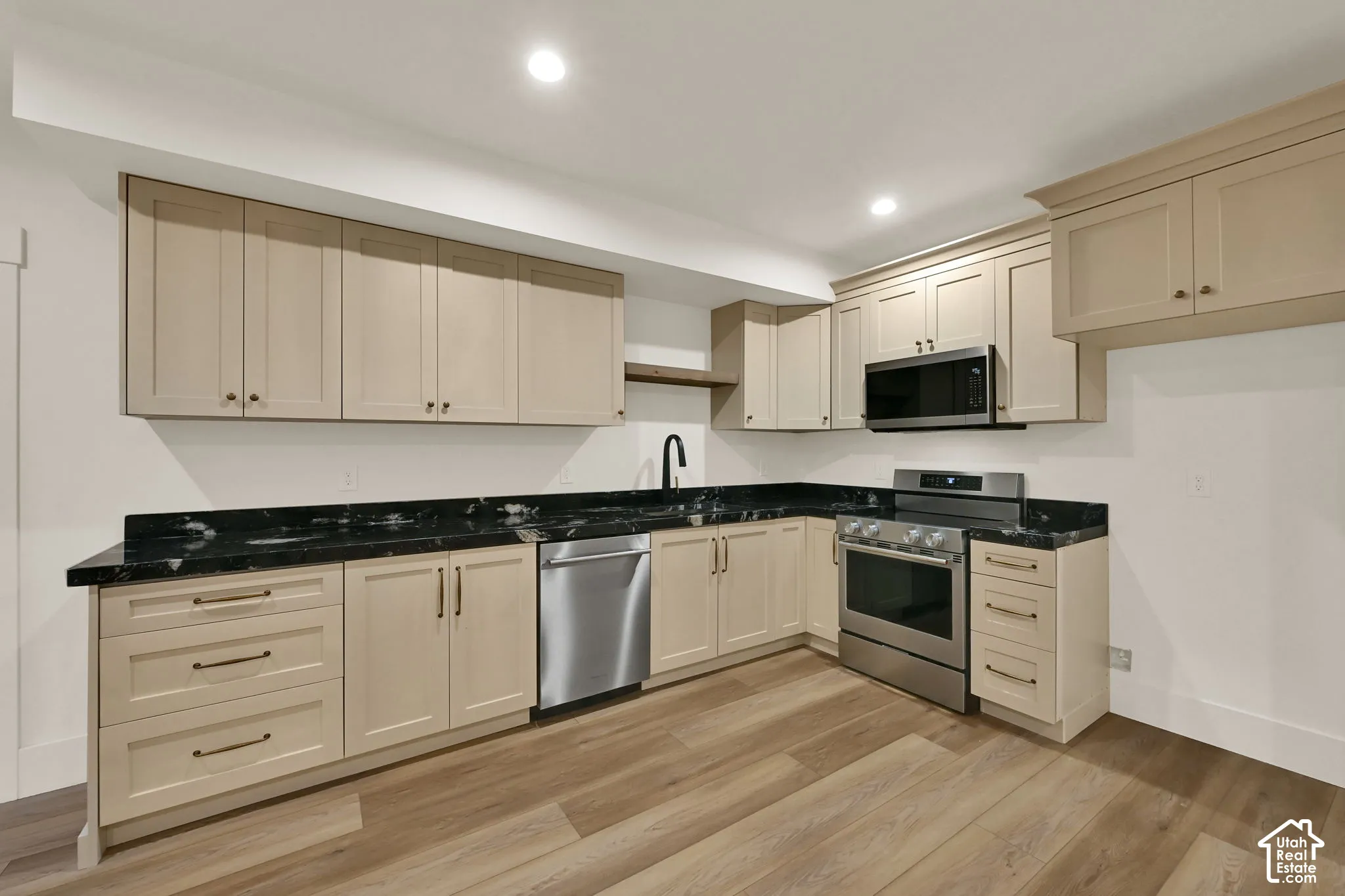 Light wood-finish flooring with recessed lighting
