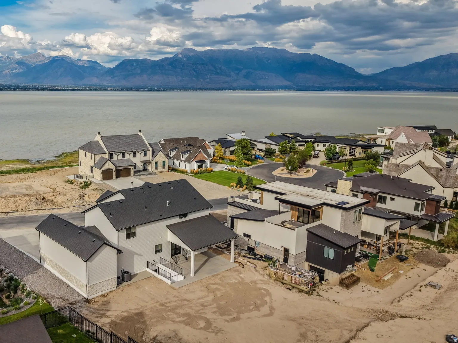 Newly constructed residence featuring modern architectural design with clean lines and neutral exterior finishes