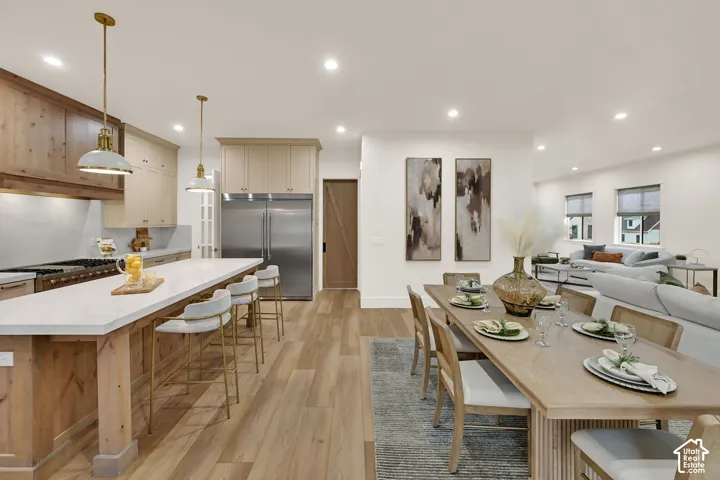 Open-concept living space with wood-finish flooring
