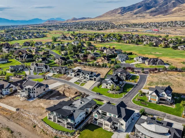 Expansive residential community with established homes, developing properties, and mountain backdrops