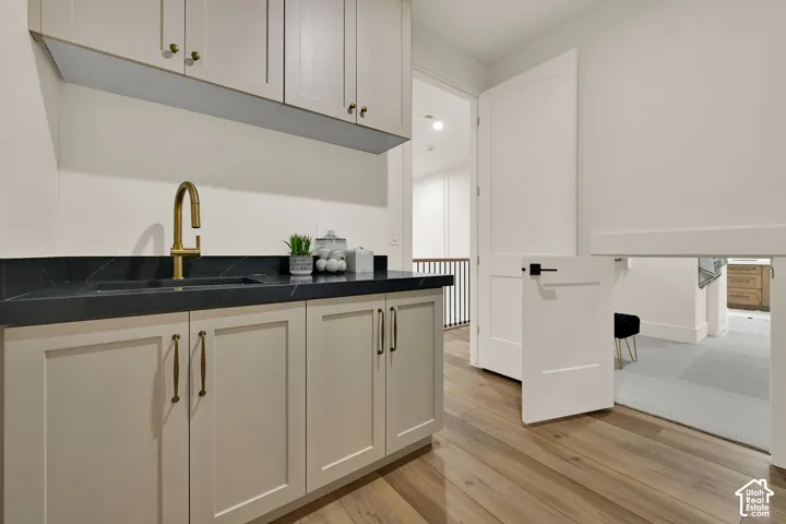Integrated utility sink with a gold-finish gooseneck faucet