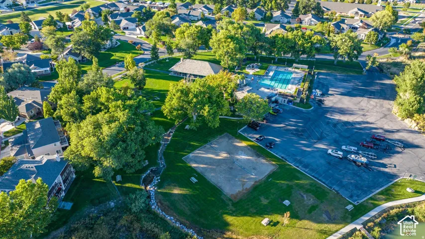 Community amenities featuring a swimming pool, volleyball court, and covered pavilion