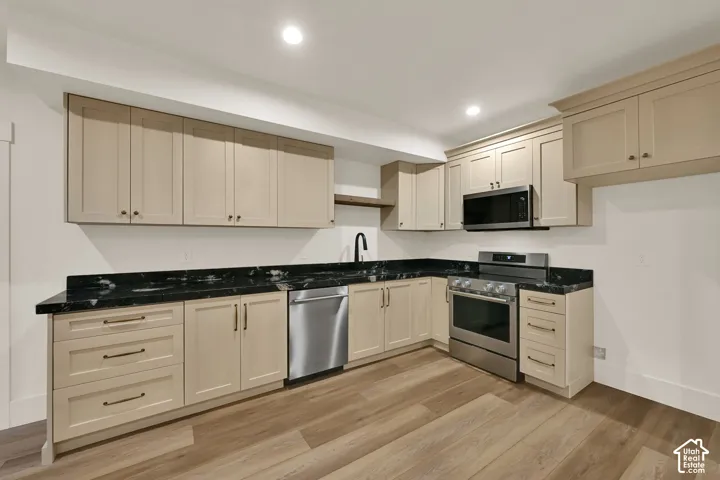 Light wood-finish flooring with recessed lighting