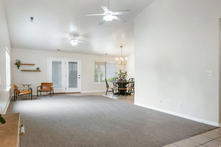 Spacious great room with vaulted ceilings and recessed lighting