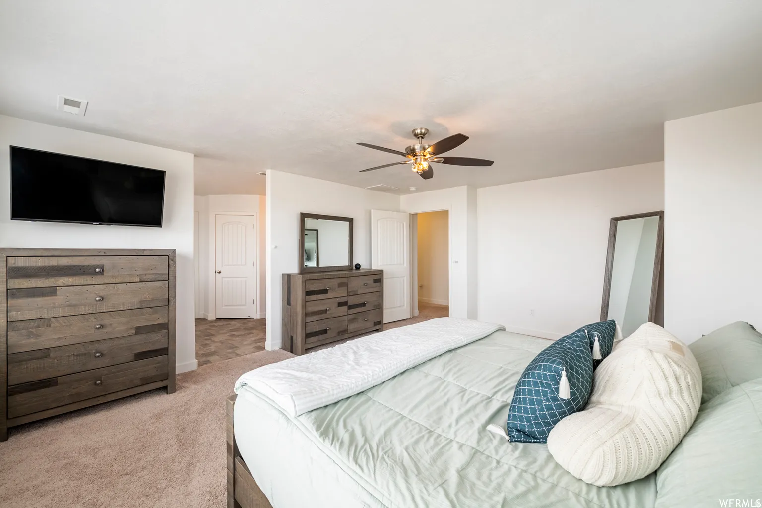 Neutral wall finishes and carpeted flooring