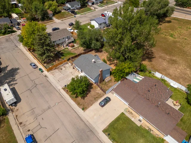 Aerial view showcasing two residences on a single lot with distinct architectural styles