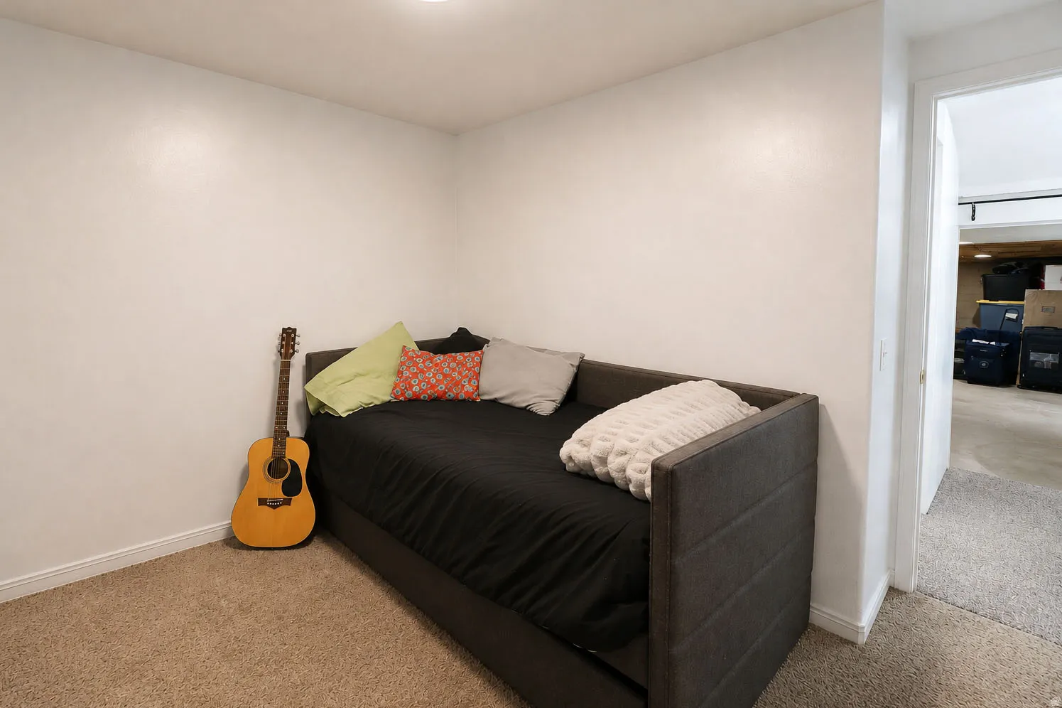Neutral tone wall color, recessed lighting, and carpeted flooring