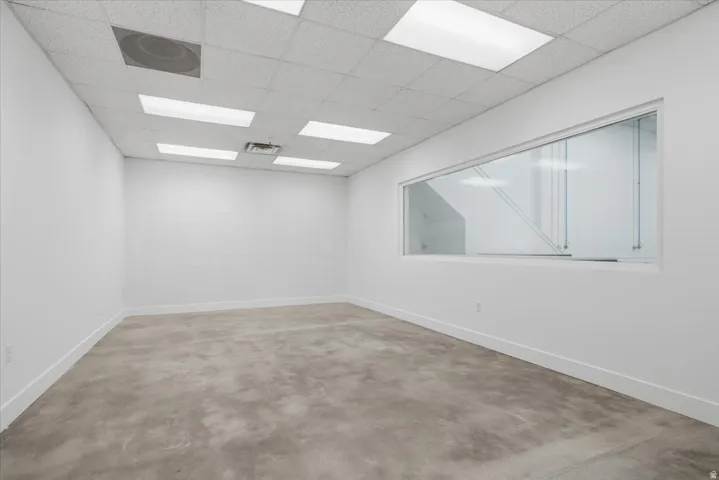 Bright, open interior space with polished concrete flooring and crisp white walls