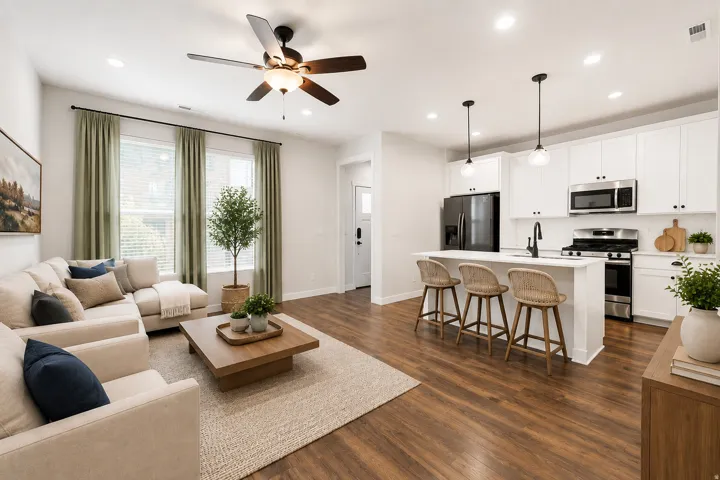 Open-concept living space featuring wood-finish flooring, recessed lighting, and a ceiling fan
