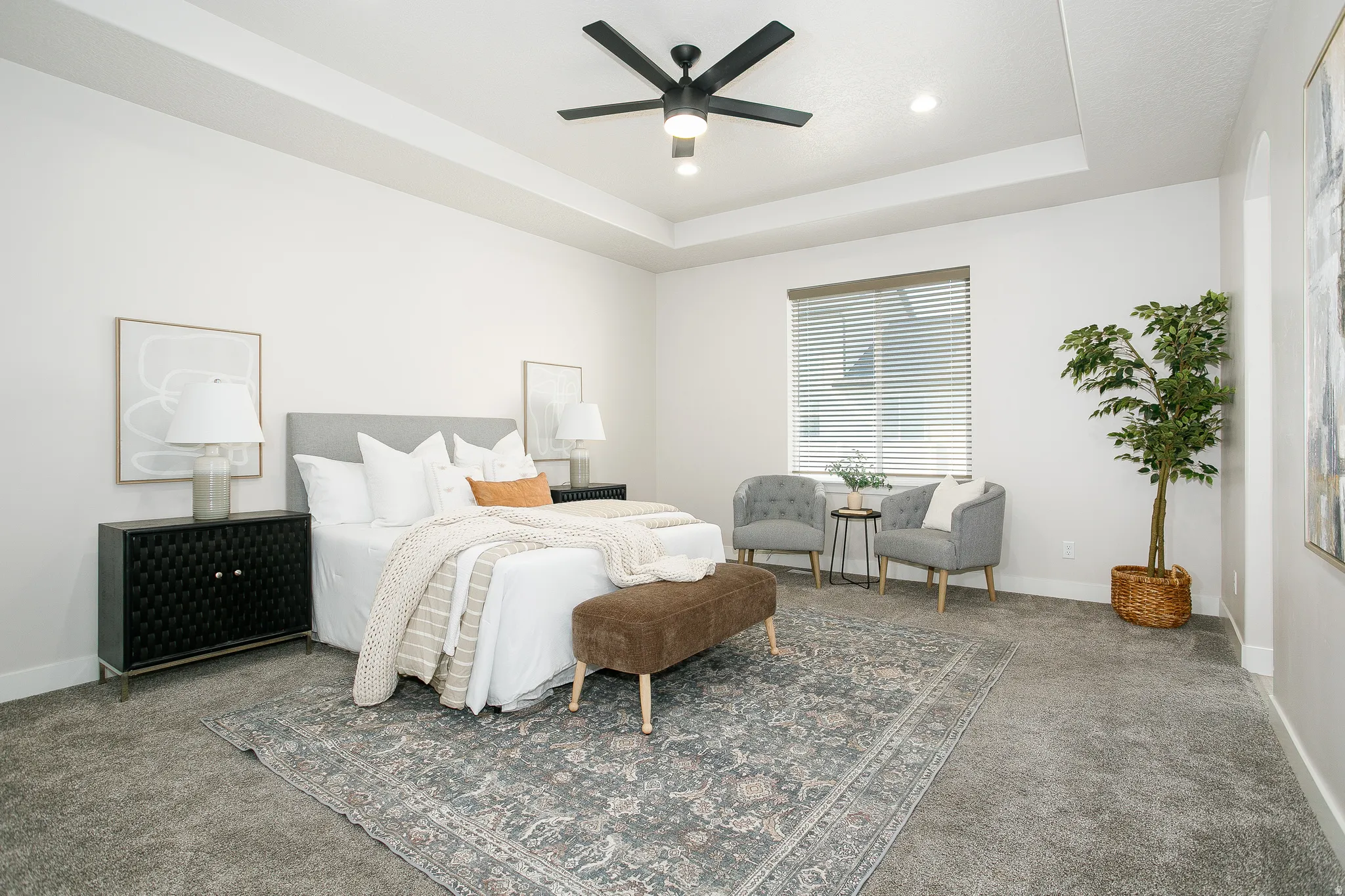 Tray ceiling with recessed lighting and a ceiling fan