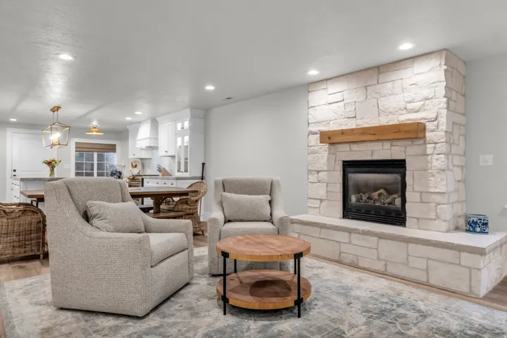 Basement- Stone-faced fireplace with a wood mantel