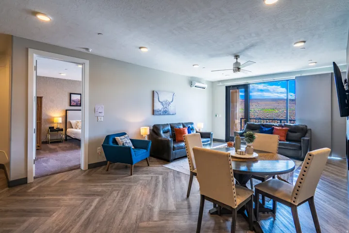 Herringbone wood-finish flooring throughout, recessed lighting, and ceiling fan