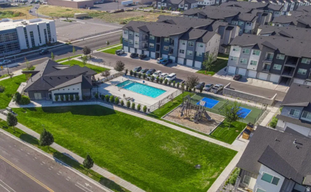 Community amenities featuring a clubhouse, swimming pool, playground, and sports court
