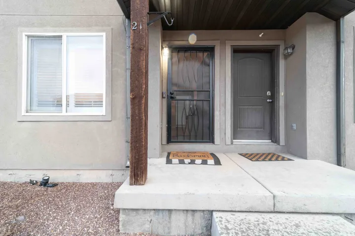 Stucco exterior with a concrete entry porch