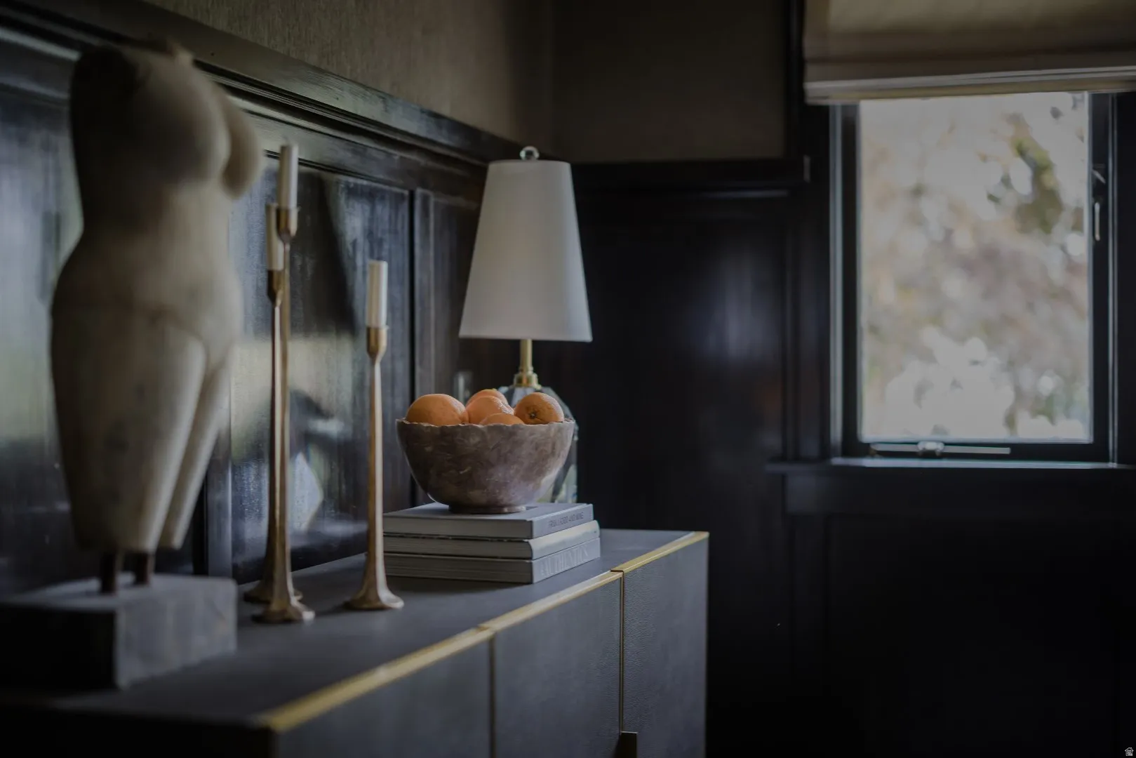 Paneling with a dark finish, built-in window, and built-in cabinetry