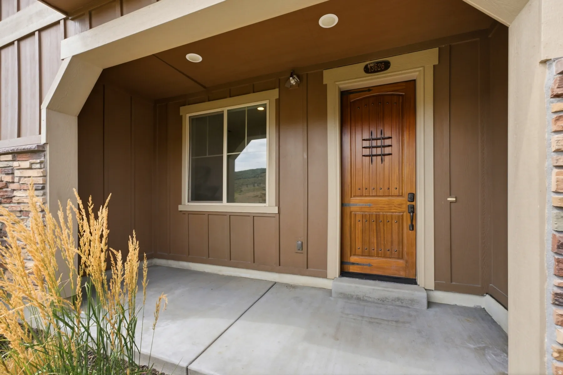 Crafted wooden entry door with decorative ironwork