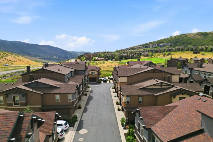 Townhome community featuring pitched shingle roofs and integrated garages