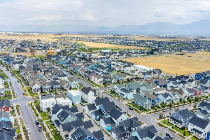 Expansive residential development featuring numerous single-family homes, mature landscaping, and paved streets