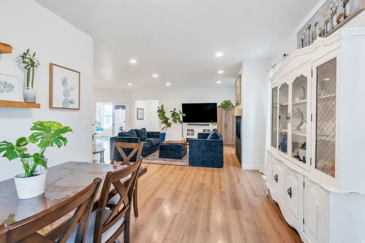 Wood-finish flooring, recessed lighting, and a built-in display cabinet
