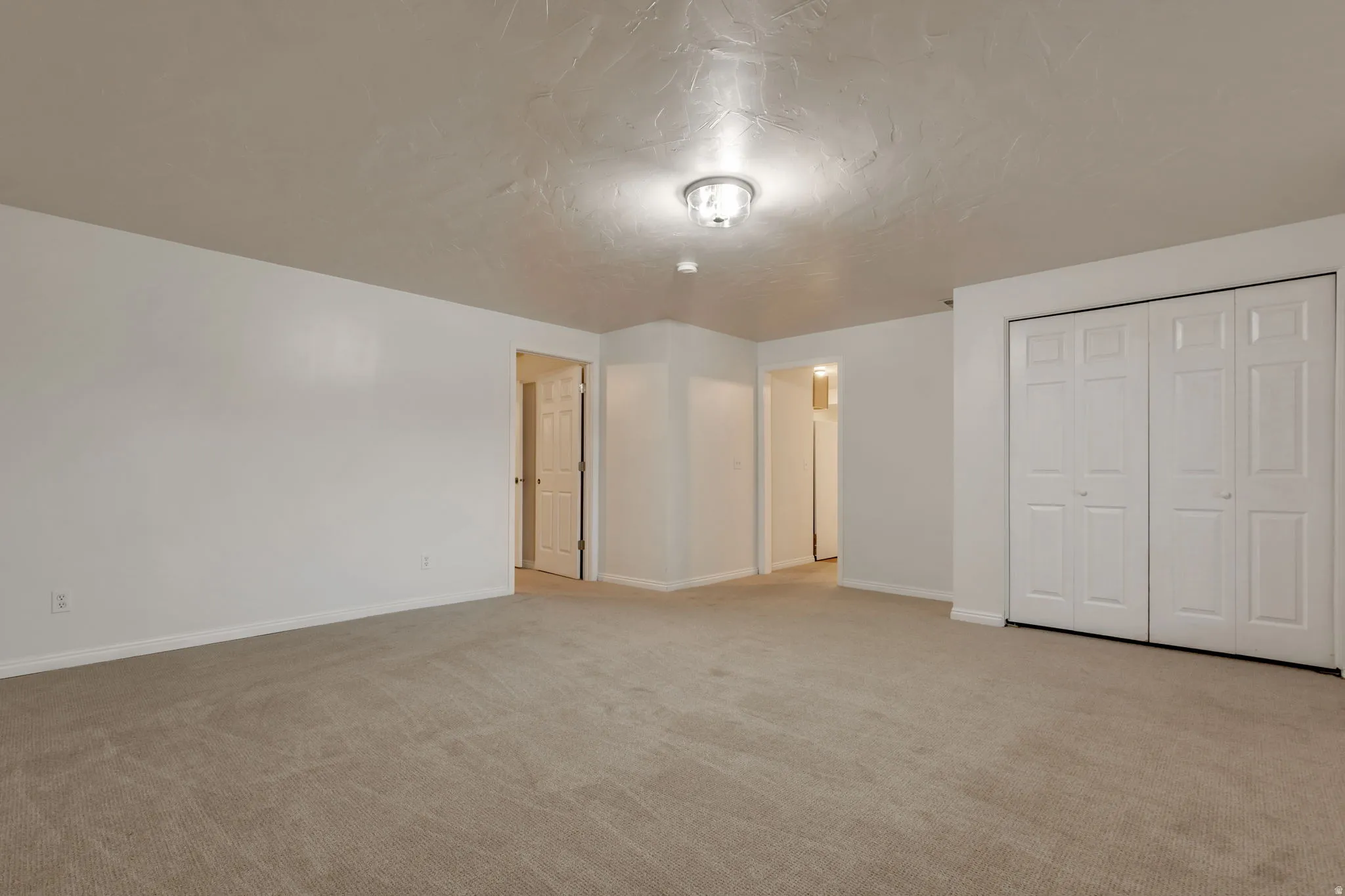 Neutral-toned carpeting throughout