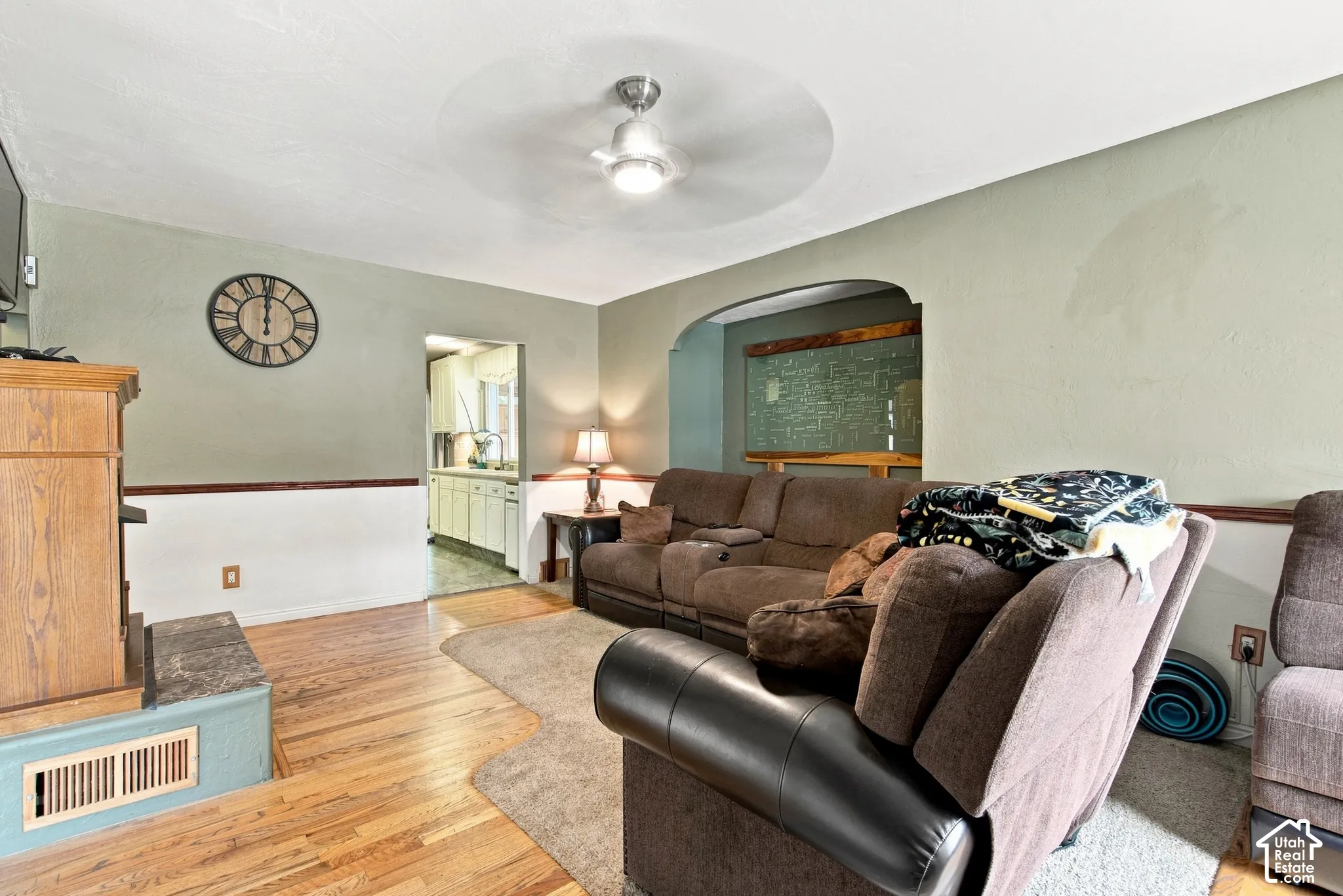 Living room facing entry to kitchen