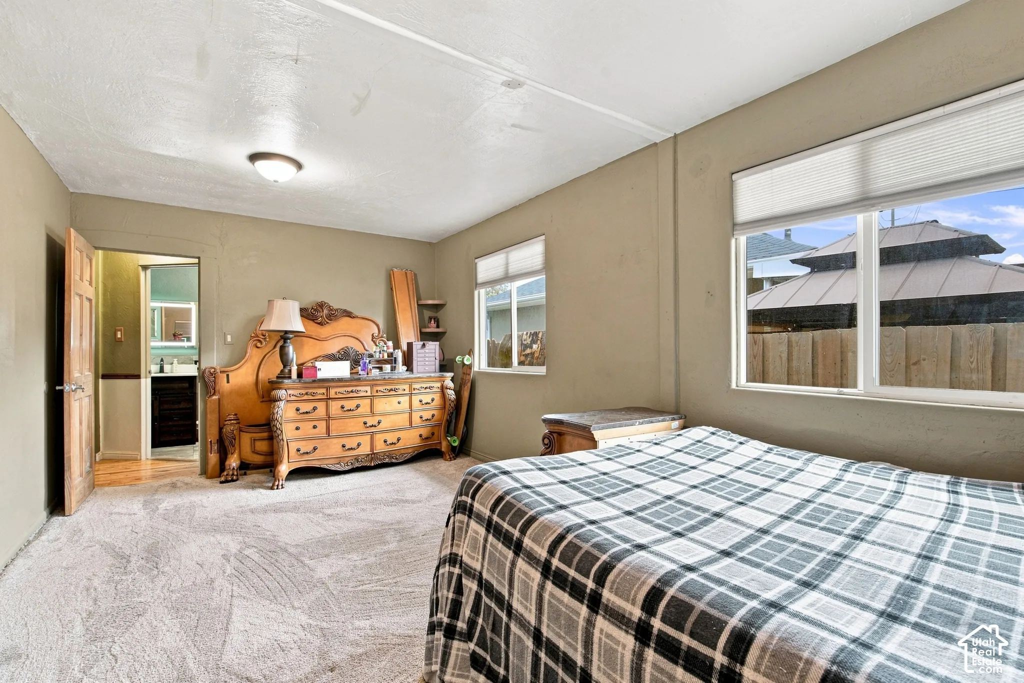 Primary bedroom with walk in closet facing hallway