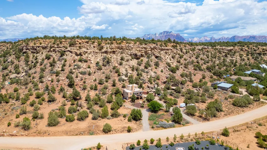 Desert landscape featuring natural rock formations and abundant native vegetation