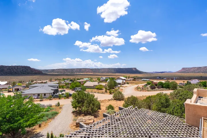 Elevated perspective showcasing surrounding properties and distant mesa formations