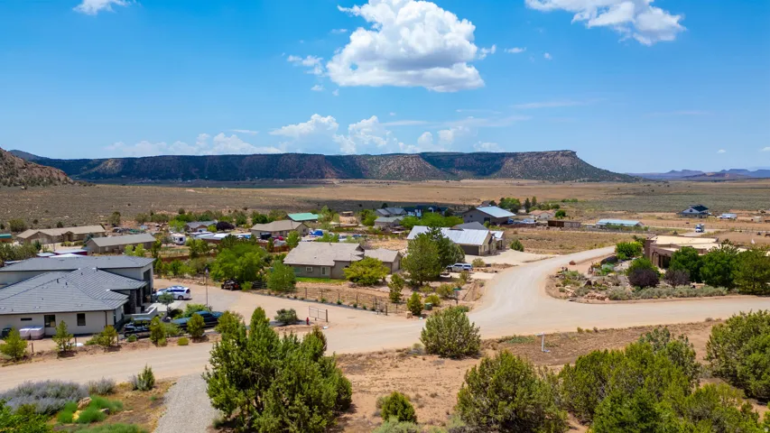 Expansive desert landscape with distant flat-topped mesas