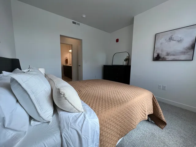 Plush carpet flooring complements crisp white walls