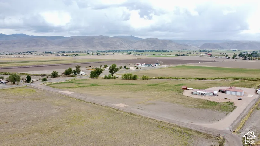 Expansive rural property featuring natural landscape with distant mountains