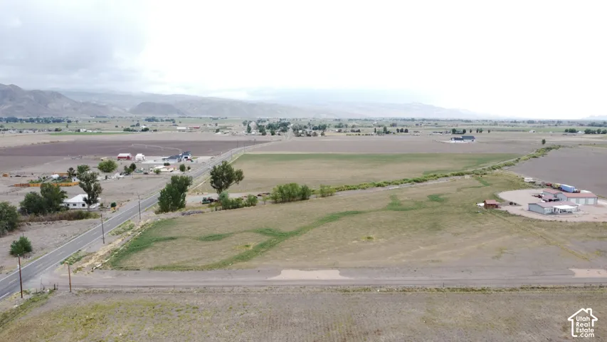 Expansive open land with distant mountain ranges