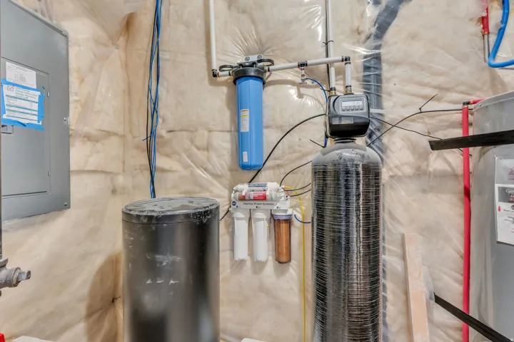 Water filtration system, water softener, electrical panel, and water heater