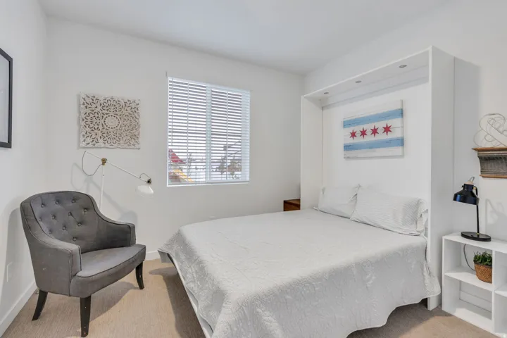 Main floor bedroom with a murphy bed.