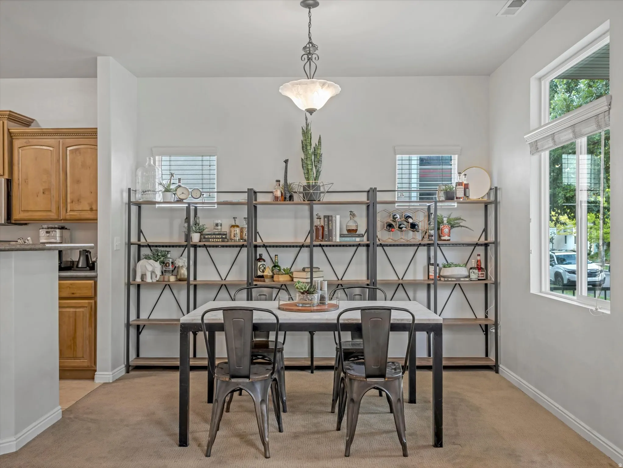 Dining area with chandelier and windows