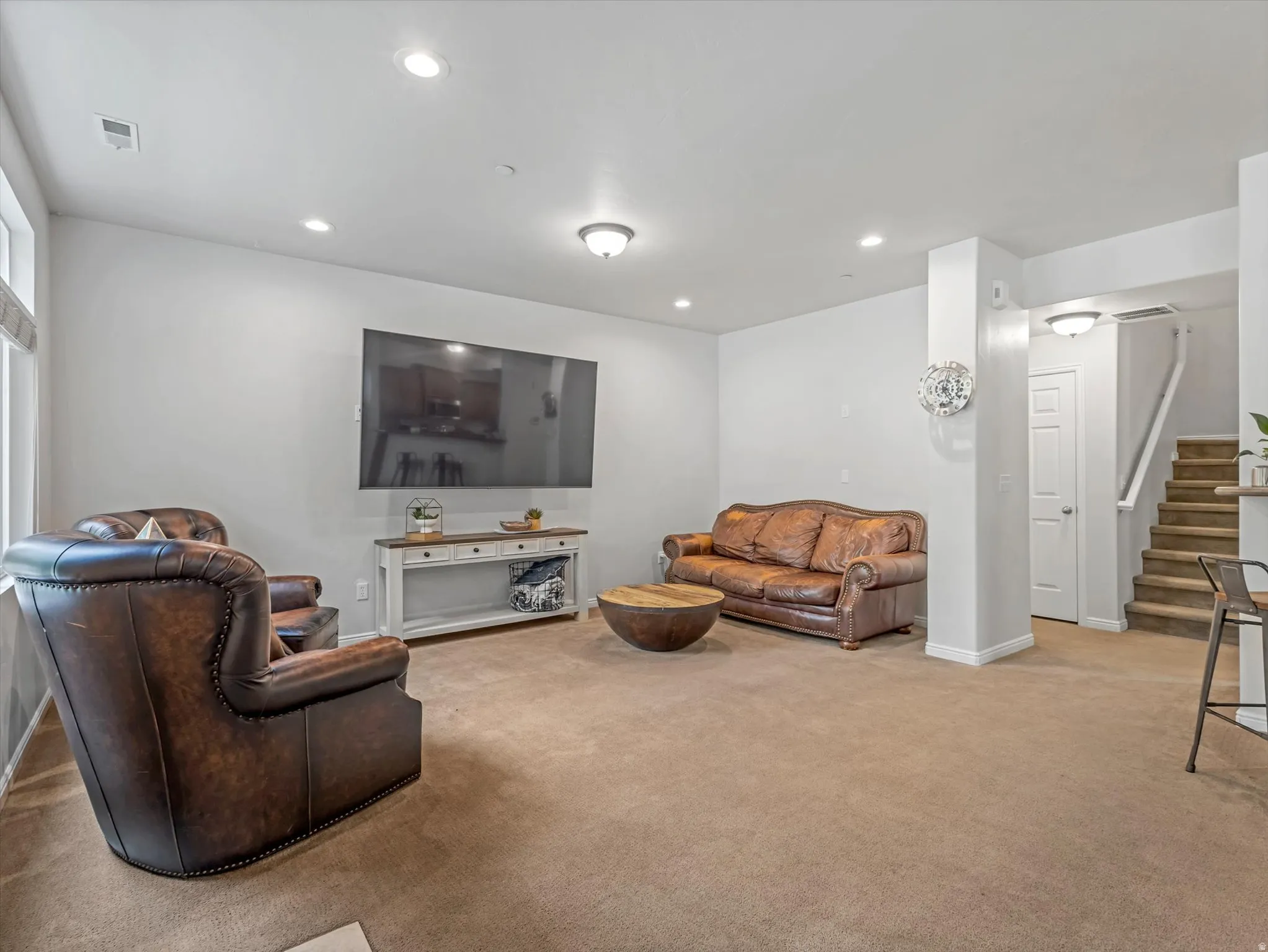 Recessed and flush mount ceiling lighting with light gray wall finishes