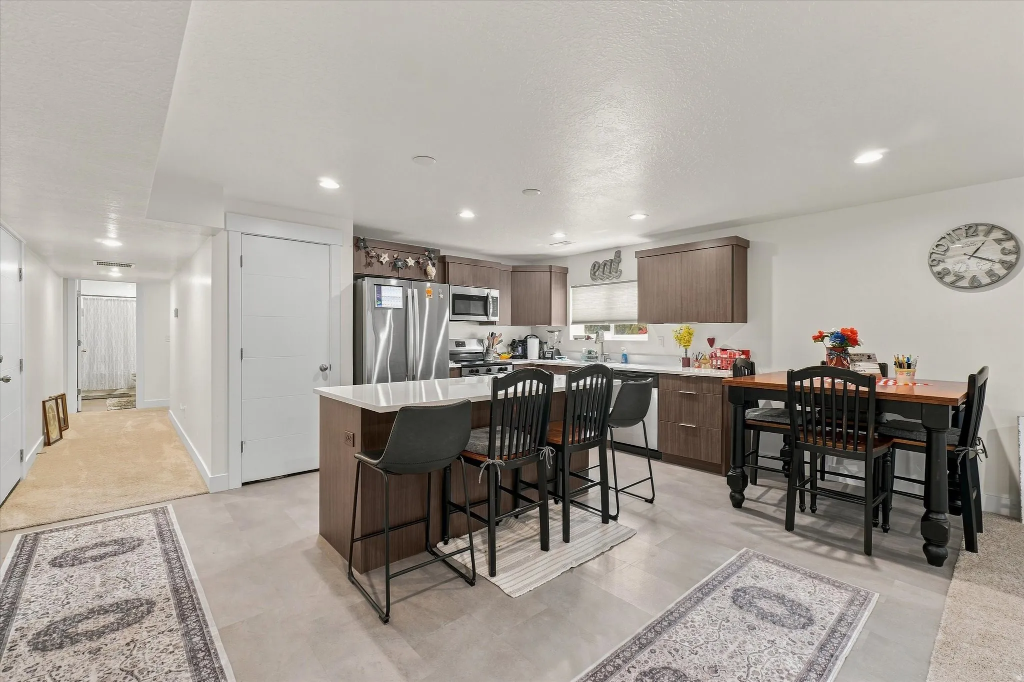 Modern kitchen featuring stainless steel appliances and wood-finish cabinetry