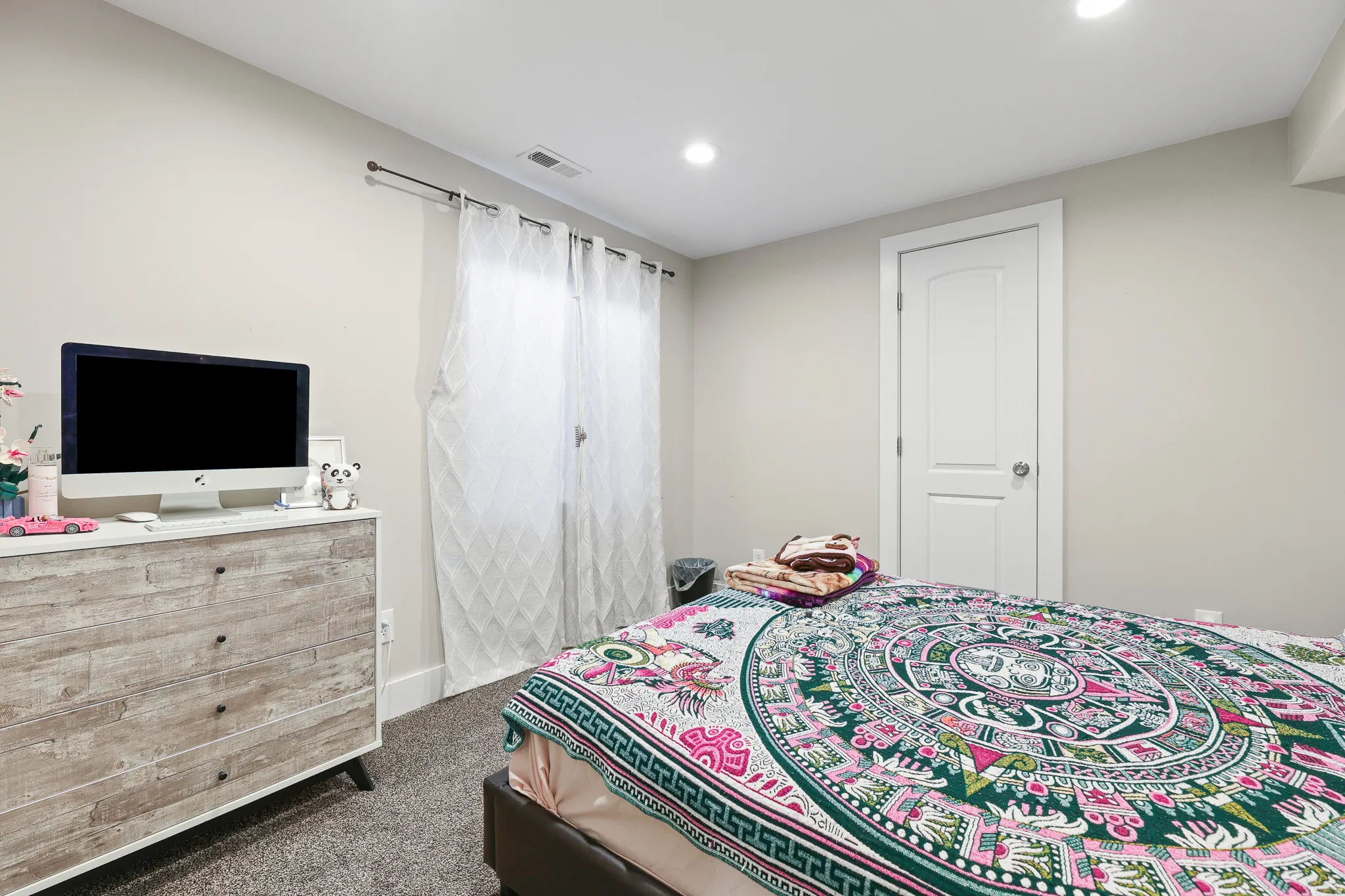 Recessed lighting, painted walls, wall-to-wall carpeting, and a two-panel interior door