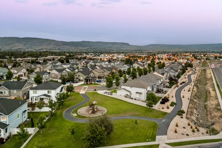 Neighborhood park with playground equipment and paved walking paths