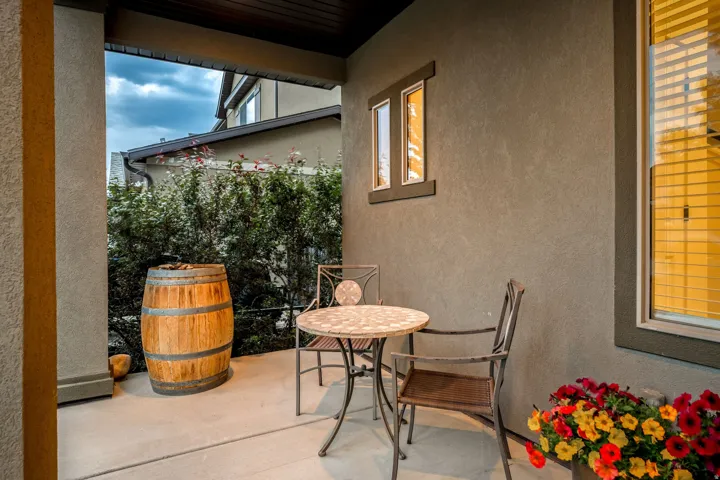 Private outdoor patio featuring a concrete surface and stucco walls