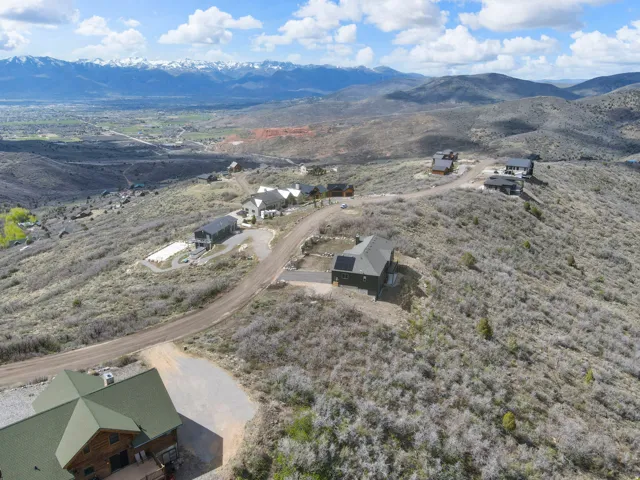 Expansive rural landscape featuring multiple homesites and distant mountain ranges