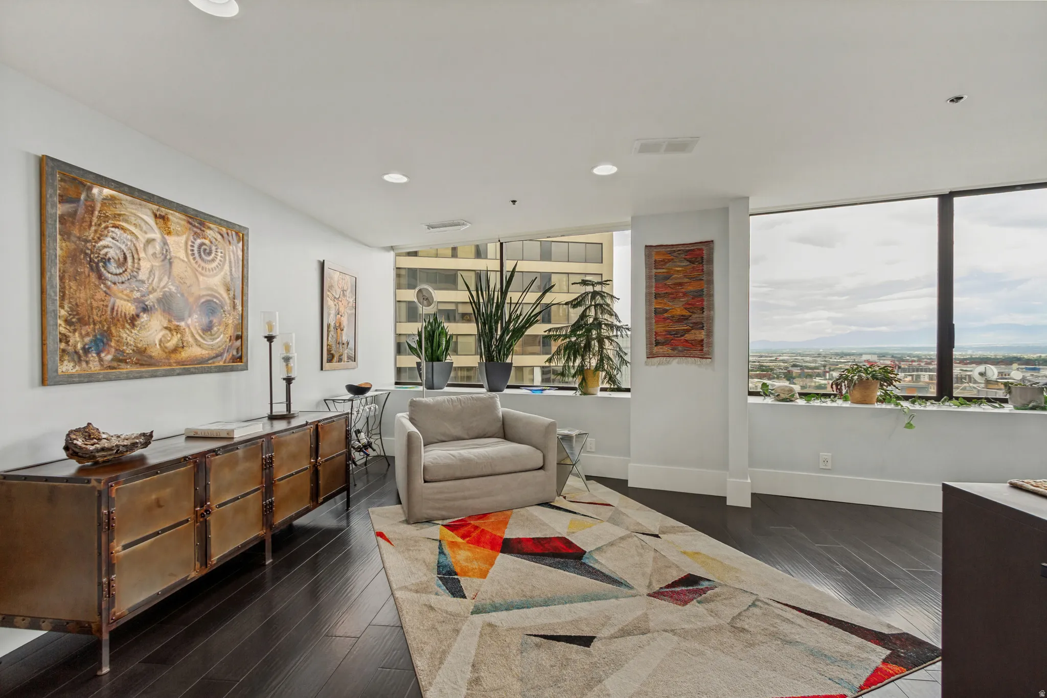 Expansive windows provide ample natural light and elevated urban scenery