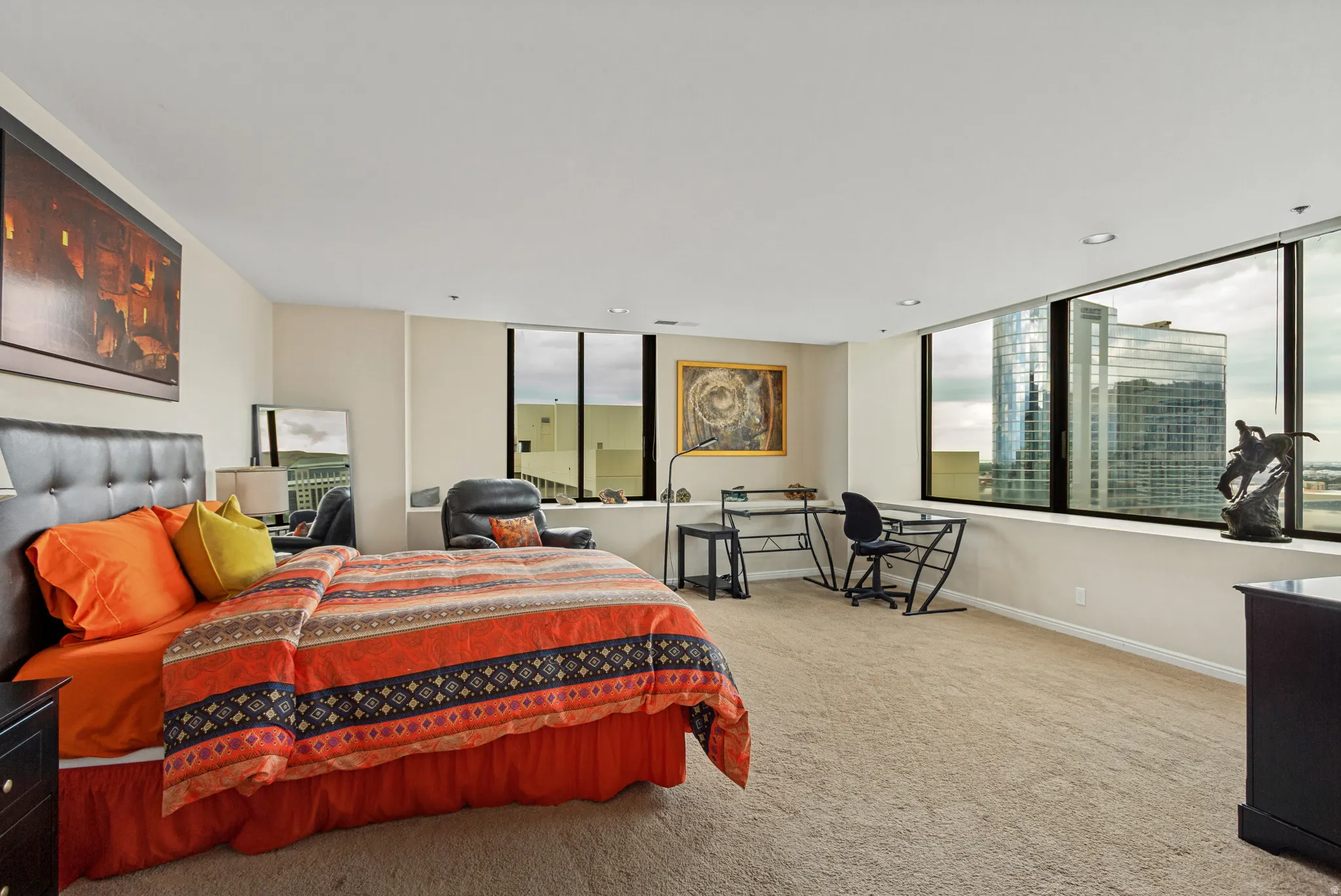 Expansive primary bedroom with views west through north