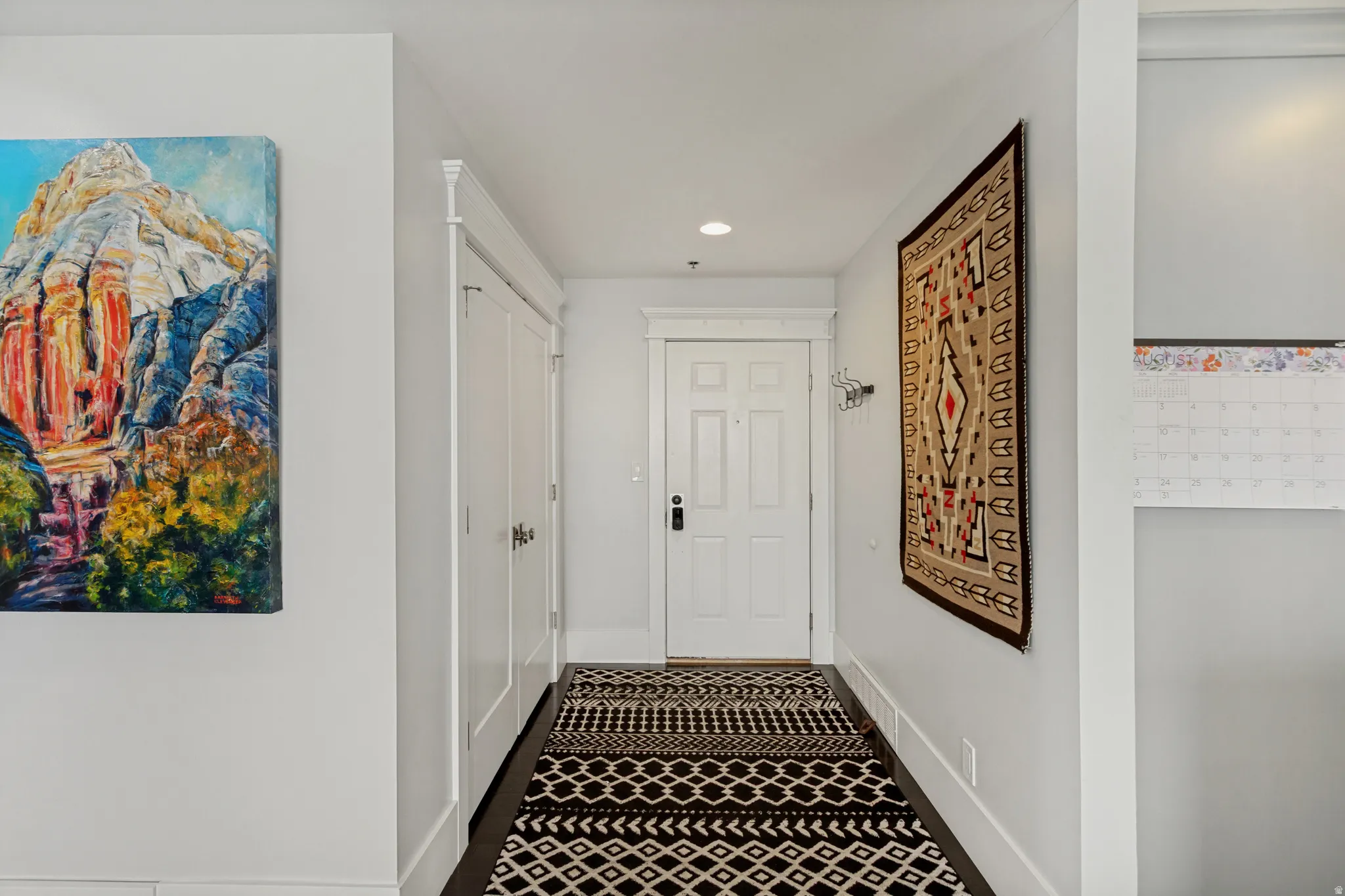 Inviting entryway with large coat closet