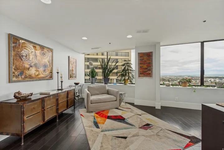 Expansive windows provide ample natural light and elevated urban scenery