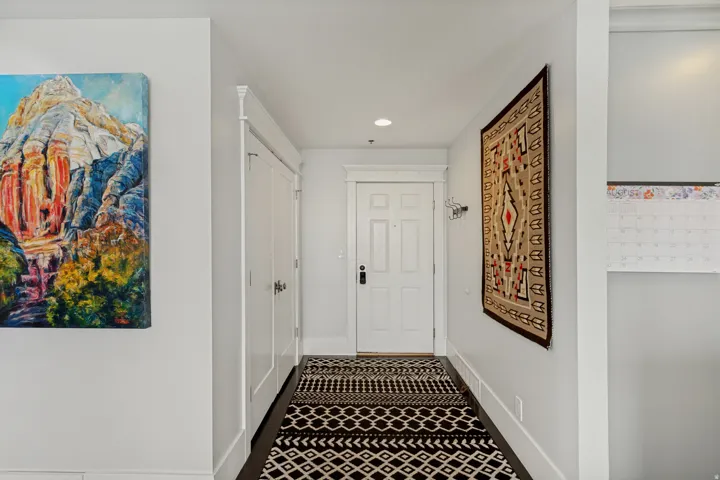 Inviting entryway with large coat closet