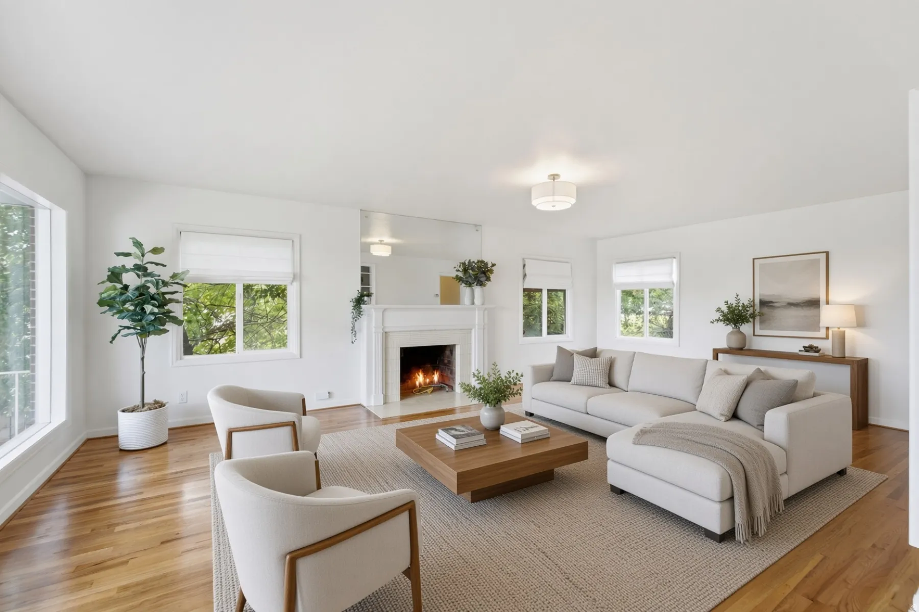 Hardwood flooring, fireplace with mantel, recessed lighting, multiple windows, and a flush mount ceiling fixture
