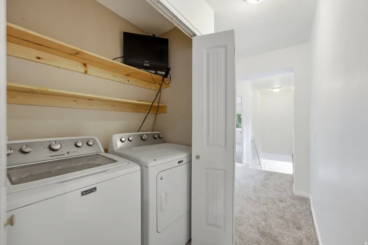 Laundry closet with built-in shelving